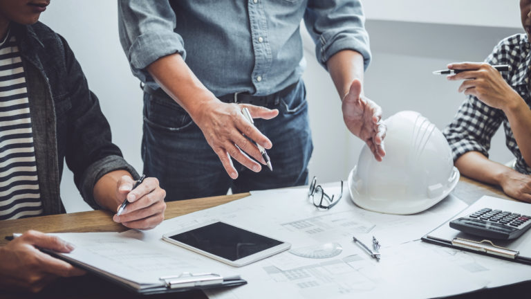 Engineer explaining tasks to his co-employees